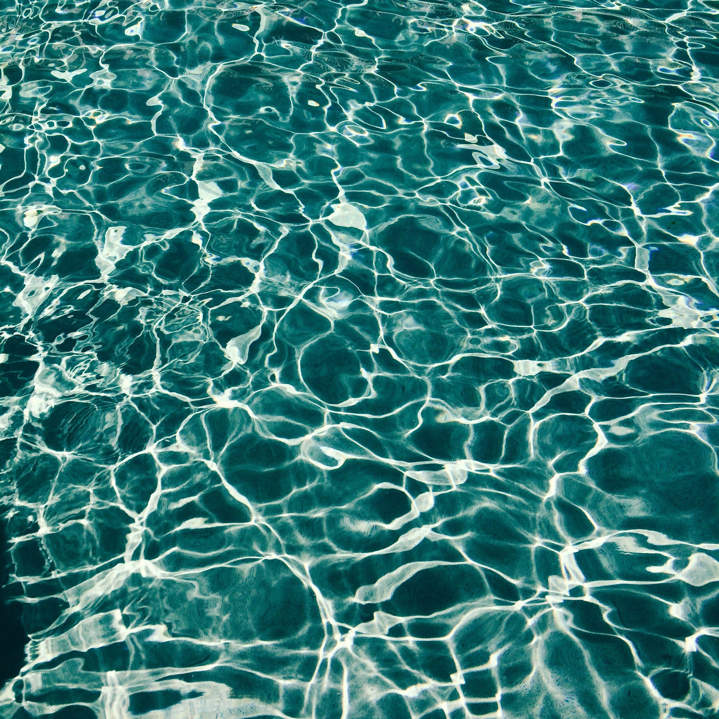 Close-up of textured teal water surface