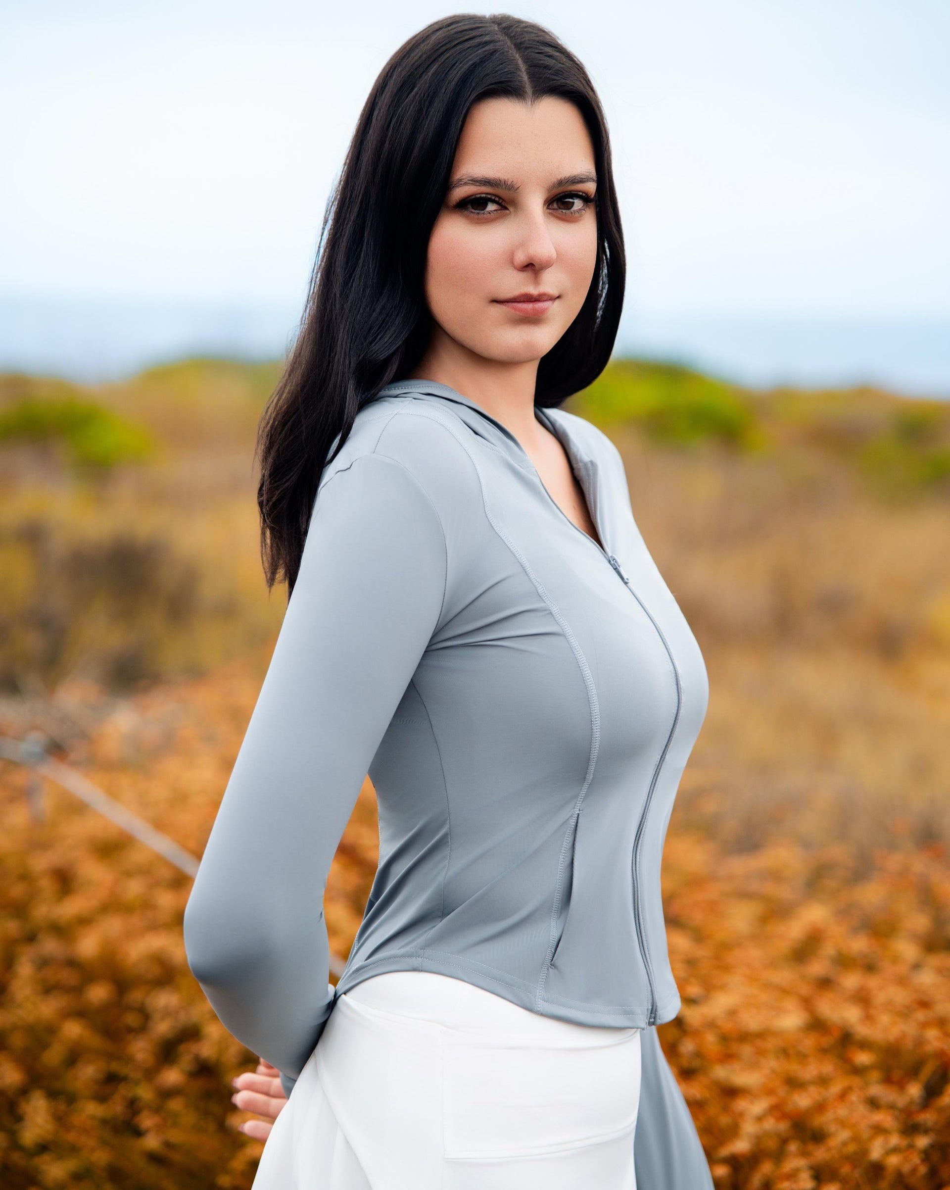 VLIZ IceShield UV Full-Zip SlimFit Hooded Top in Ash Gray, featuring an ice-touch UV-protective fabric, sleek silhouette, full-length zip, and a sun-shielding hood—ideal for outdoor training, hiking, tennis, and everyday layering.