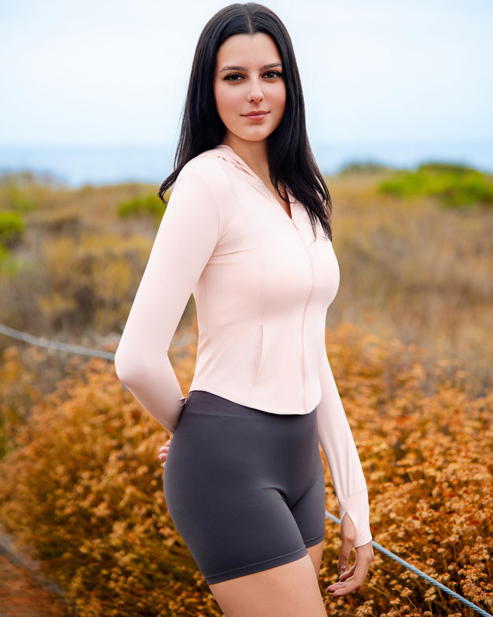 VLIZ IceShield UV Full-Zip SlimFit Hooded Top in Peach Pink, featuring an ice-touch UV-protective fabric, sleek silhouette, full-length zip, and a sun-shielding hood—ideal for outdoor training, hiking, tennis, and everyday layering.