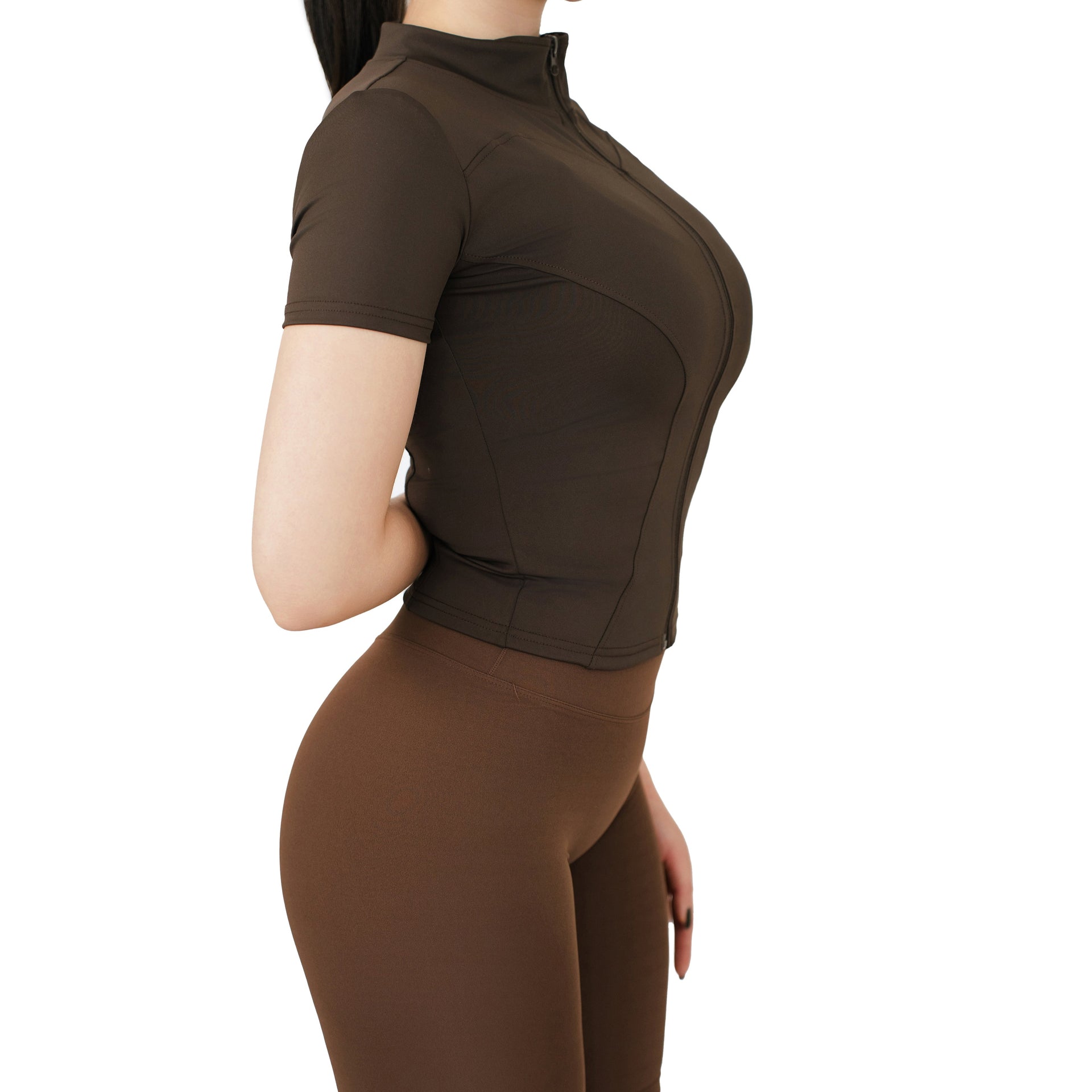 Side view of VLIZ Full-Zip SculptFit Short Sleeve Top in Espresso – sculpted fit with curved seams and stand collar.