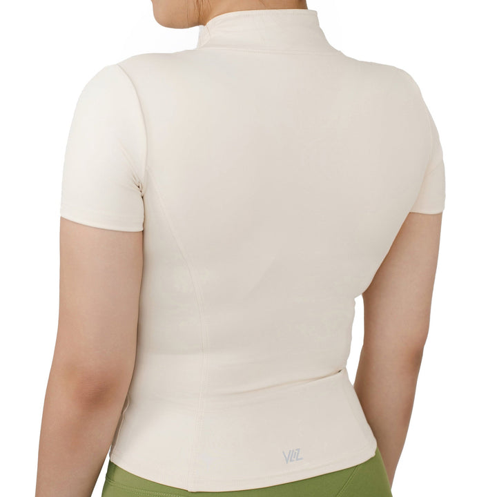 Back side view of VLIZ Full-Zip SculptFit Short Sleeve Top in White, highlighting its sculpting fit and smooth finish on the upper back.