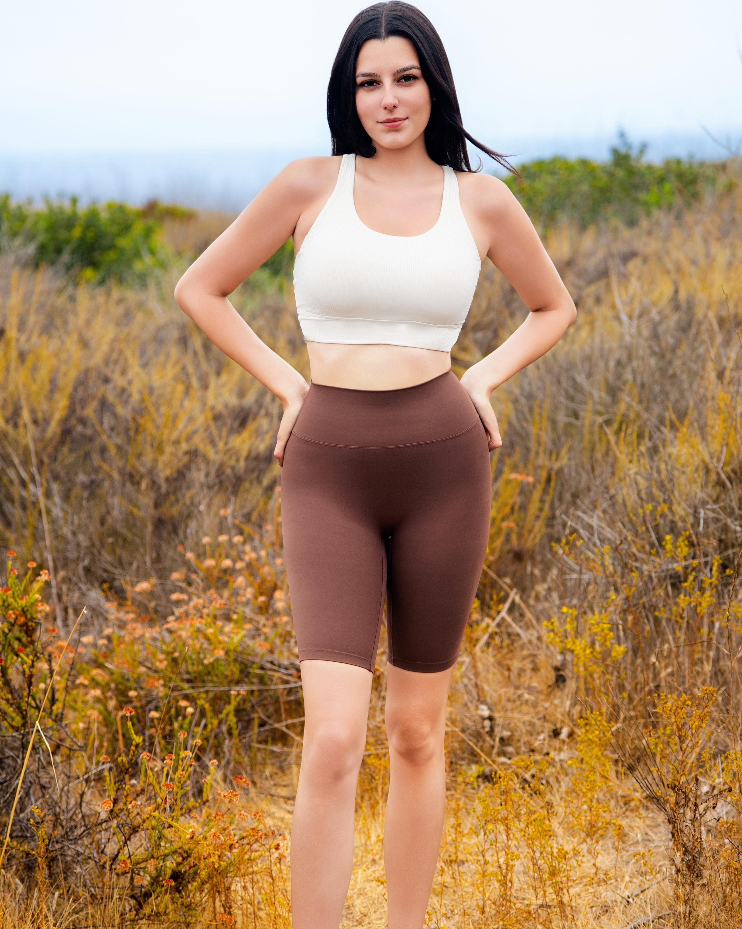 VLIZ BareSkin Mid-Length Leggings – Chestnut Brown; high-waisted design; compressive contour fit; hidden phone pocket at inner back waistband; suitable for yoga, Pilates, cardio, and everyday training.