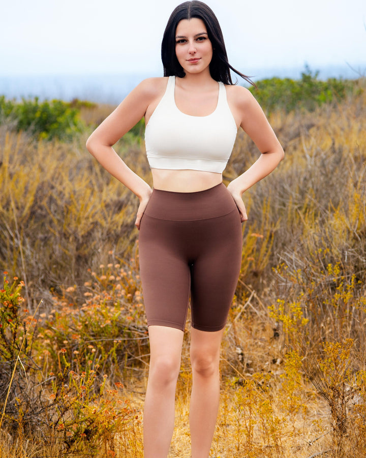 VLIZ BareSkin Mid-Length Leggings – Chestnut Brown; high-waisted design; compressive contour fit; hidden phone pocket at inner back waistband; suitable for yoga, Pilates, cardio, and everyday training.