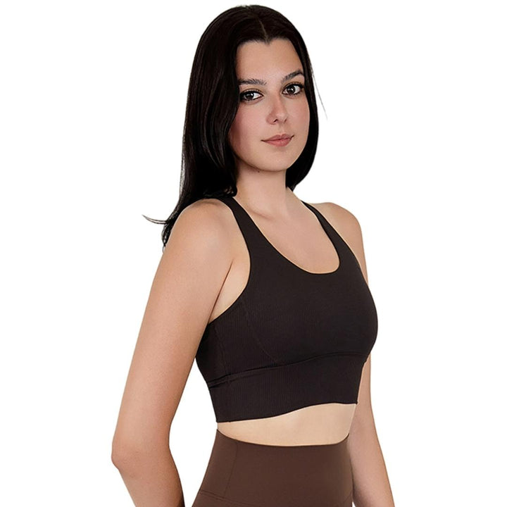 Model in VLIZ ContourFlex Cross-Back Sports Bra in Espresso, featuring criss-cross back straps and a sculpting, supportive fit ideal for yoga, Pilates, cardio, tennis, and everyday active movement.