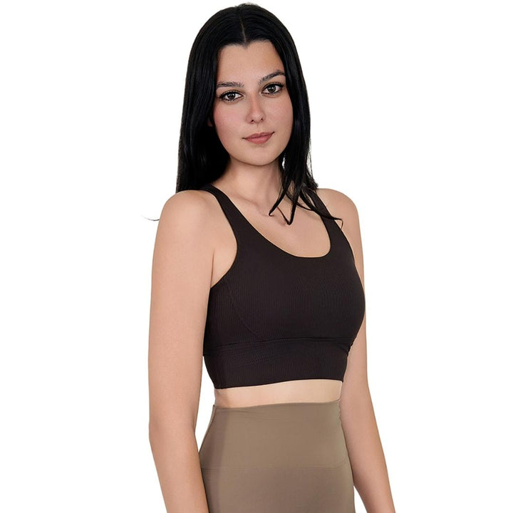 Model in VLIZ ContourFlex Cross-Back Sports Bra in Espresso, featuring criss-cross back straps and a sculpting, supportive fit ideal for yoga, Pilates, cardio, tennis, and everyday active movement.