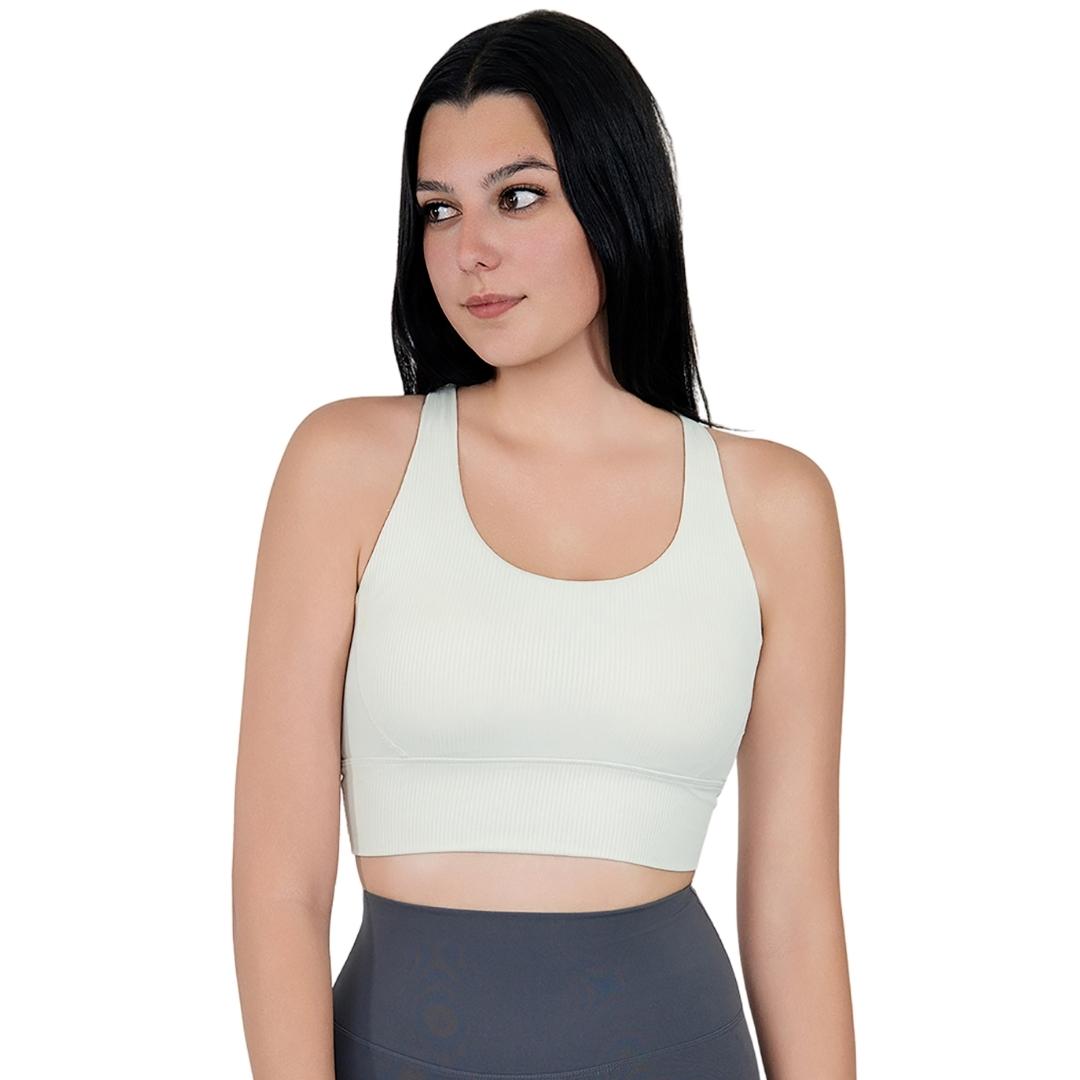 Model in VLIZ ContourFlex Cross-Back Sports Bra in White, featuring criss-cross back straps and a sculpting, supportive fit ideal for yoga, Pilates, cardio, tennis, and everyday active movement.