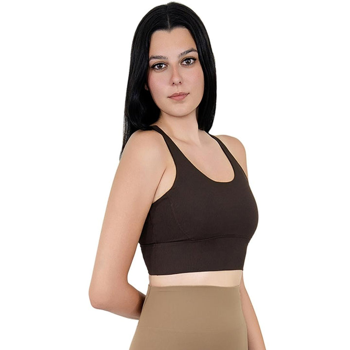Model in VLIZ ContourFlex Cross-Back Sports Bra in Espresso, featuring criss-cross back straps and a sculpting, supportive fit ideal for yoga, Pilates, cardio, tennis, and everyday active movement.