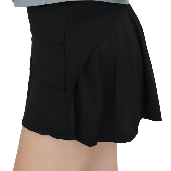 Close-up side angle of VLIZ ContourFlex High-Waist Tennis Skirt in black, showcasing seam detail and flare movement.