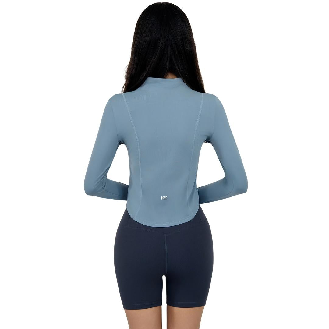 Model wearing the VLIZ Full-Zip Slim Fit Long Sleeve Top in Ash Gray, featuring an ice-touch fabric, mock neck, thumbhole cuffs, and a sleek silhouette ideal for tennis, hiking, outdoor training, and active layering.