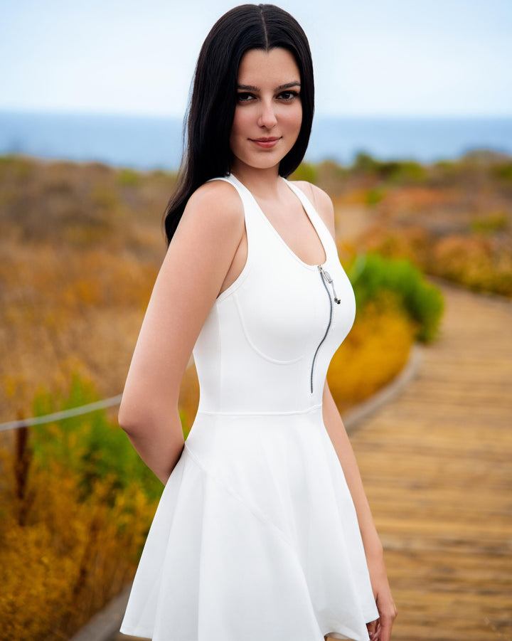 VLIZ Half-Zip Tennis Skort – White; half-zip front; contoured seams; designed for active performance; suitable for tennis, Pilates, and outdoor workouts.