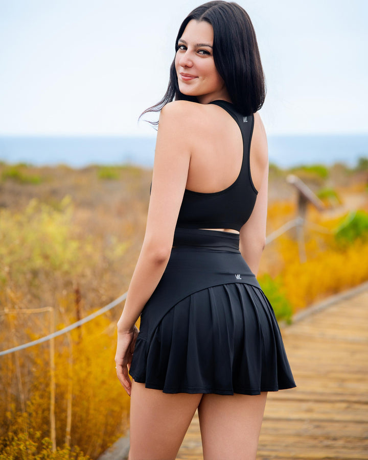 VLIZ IceSilk Tennis Skort in Black, featuring a high-rise waistband, sculpting A-line silhouette, and built-in shorts with a hidden phone pocket—perfect for tennis, golf, cardio, and casual activewear.