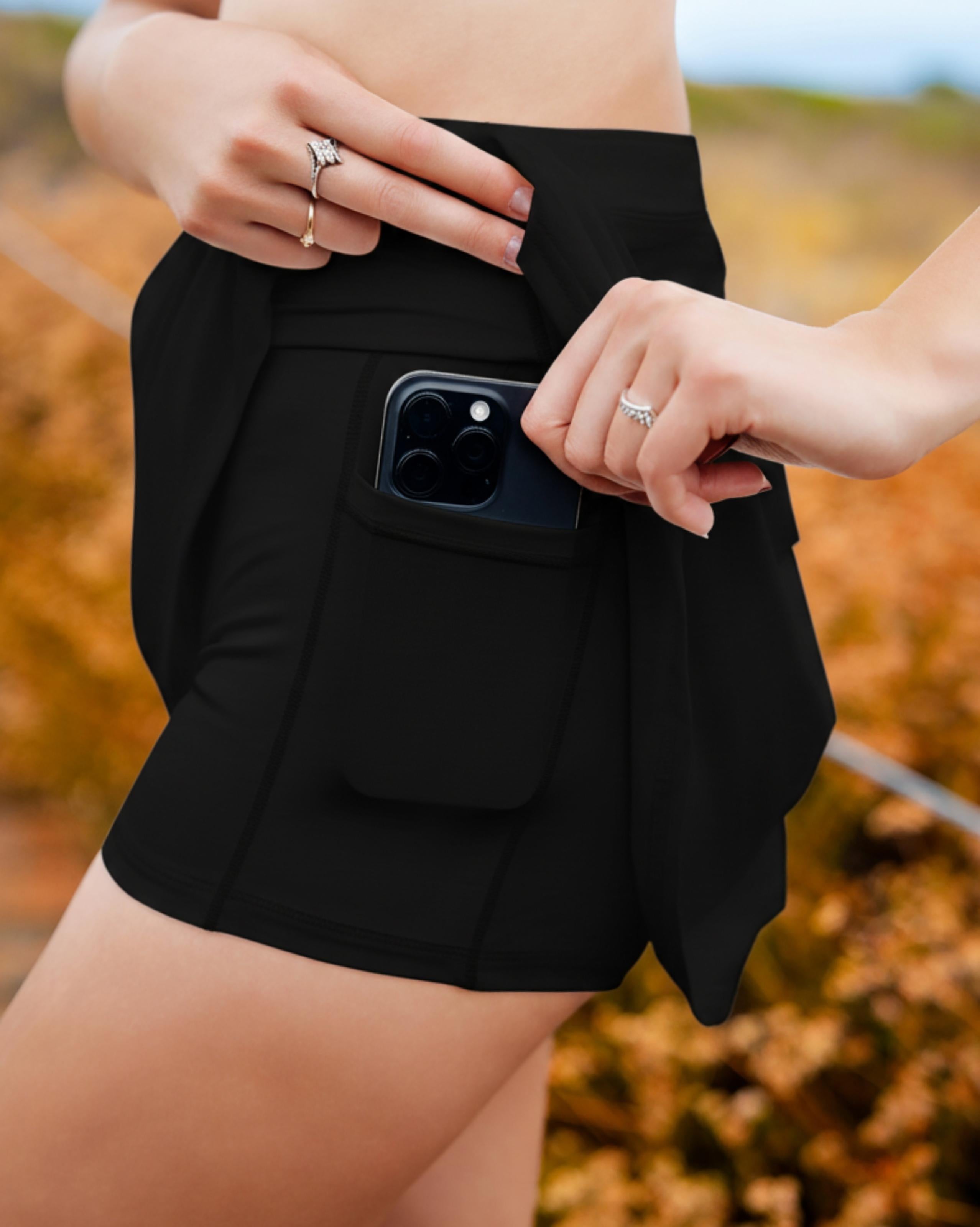 VLIZ IceSilk Tennis Skort in Black, featuring a high-rise waistband, sculpting A-line silhouette, and built-in shorts with a hidden phone pocket—perfect for tennis, golf, cardio, and casual activewear.