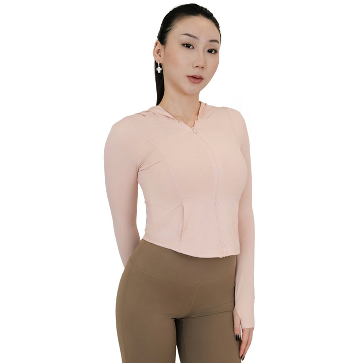 Front view of the VLIZ Rapid UV Full Zip SlimFit Hooded Top in Peach Pink, featuring full zip and hood with arms relaxed by the sides.