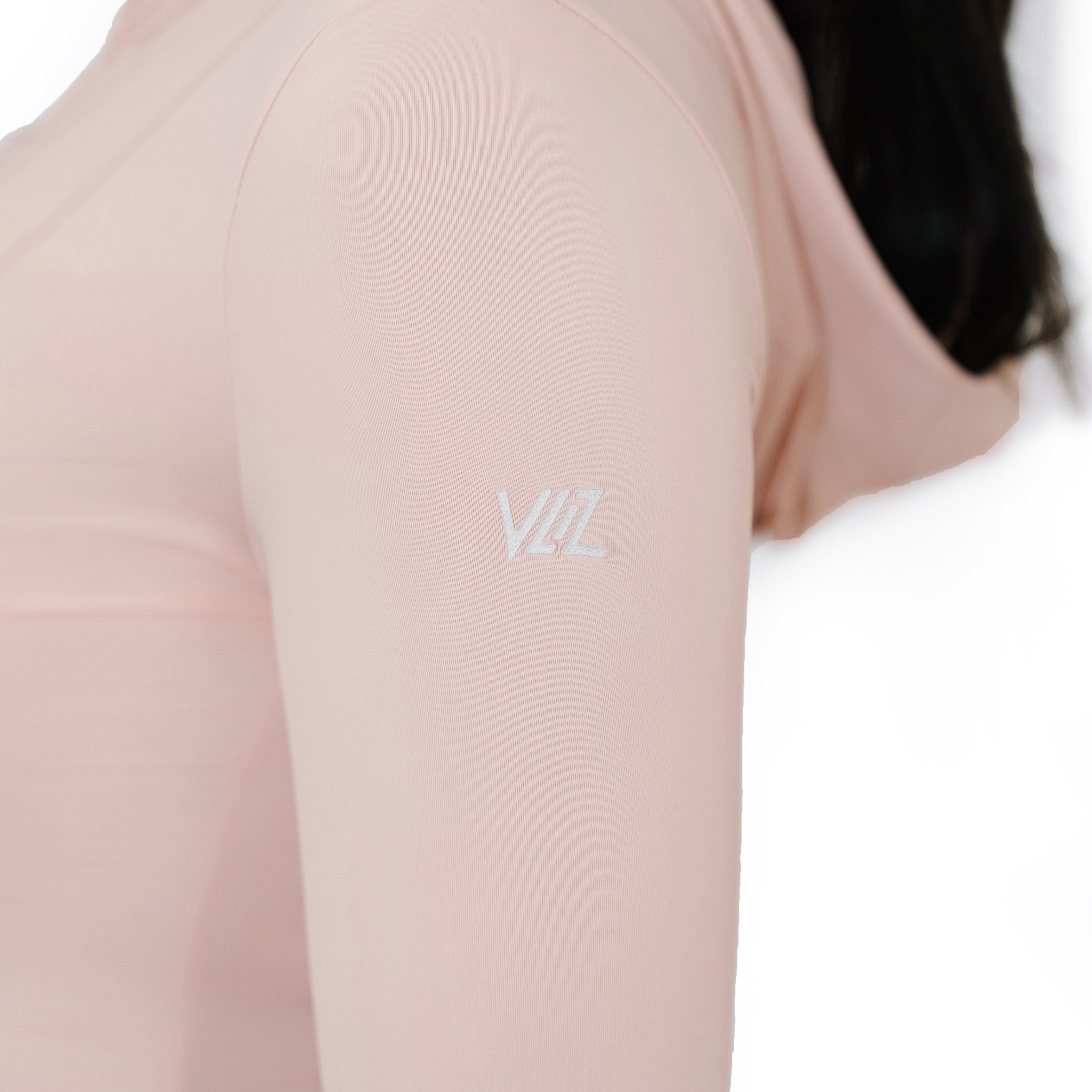 Close-up of the VLIZ logo printed on the sleeve of the Peach Pink Rapid UV Full Zip SlimFit Hooded Top, highlighting the smooth, stretchable fabric and hood.