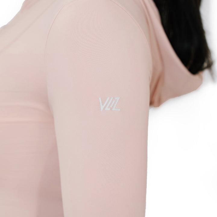Close-up of the VLIZ logo printed on the sleeve of the Peach Pink Rapid UV Full Zip SlimFit Hooded Top, highlighting the smooth, stretchable fabric and hood.