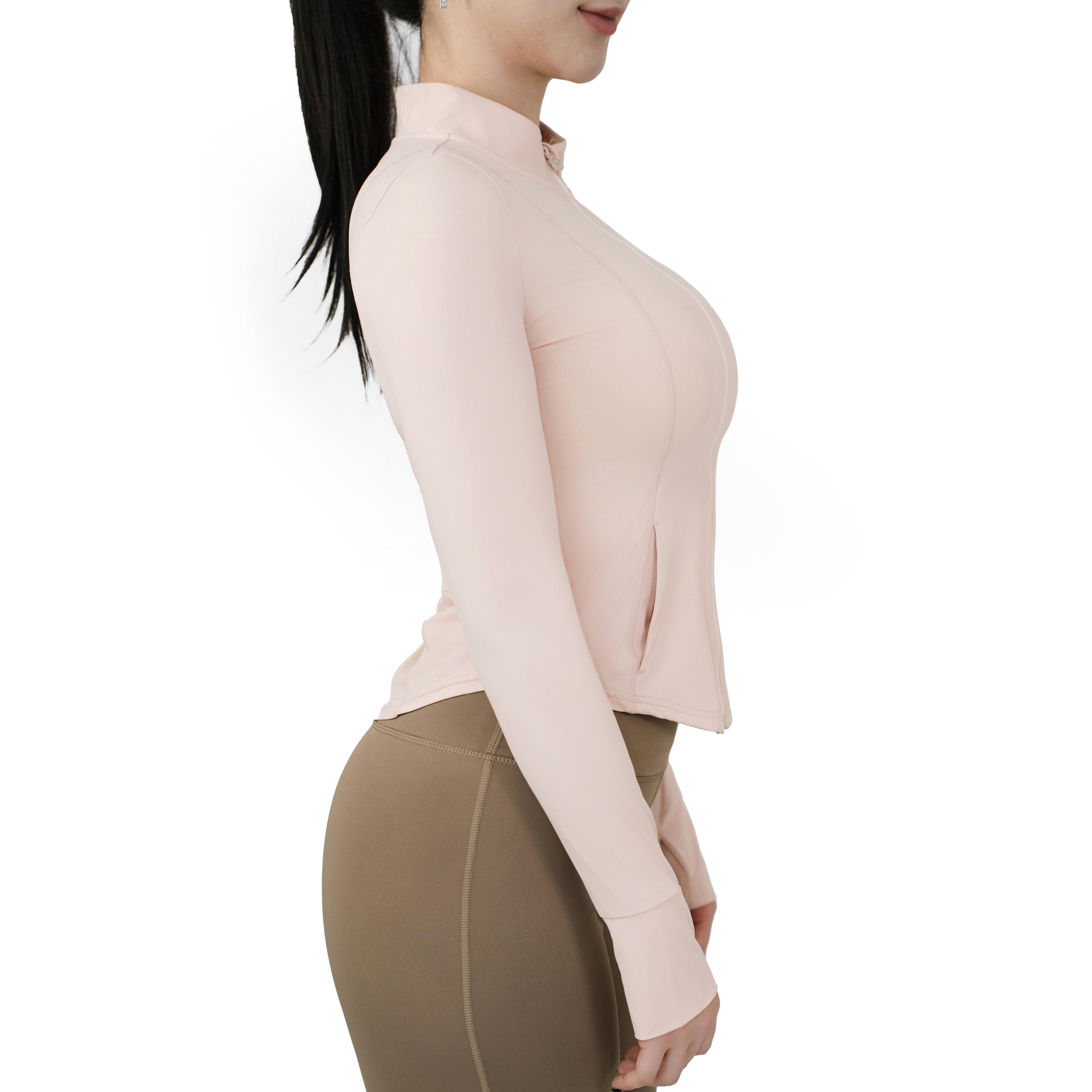 VLIZ Peach Pink SlimFit full zip top side view, showcasing long sleeves with thumbholes and sculpted fit.