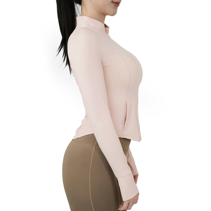 VLIZ Peach Pink SlimFit full zip top side view, showcasing long sleeves with thumbholes and sculpted fit.