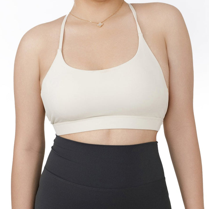 Close-up front view of the VLIZ SculptFlex Sports Bra in White, showcasing the smooth neckline, supportive band, and sleek minimalist design.