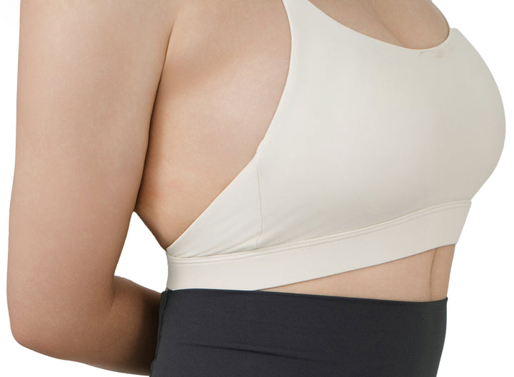 Side detail view of the VLIZ SculptFlex Sports Bra in White, highlighting the smooth fabric, clean stitching, and supportive elastic underband.