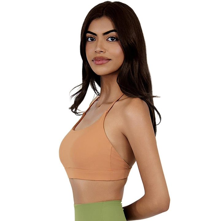 VLIZ SculptFlex Cross-Back Sports Bra in Caramel Orange, featuring a scoop neckline and sleek, supportive fit, ideally for yoga, gym, and lifestyle layering.