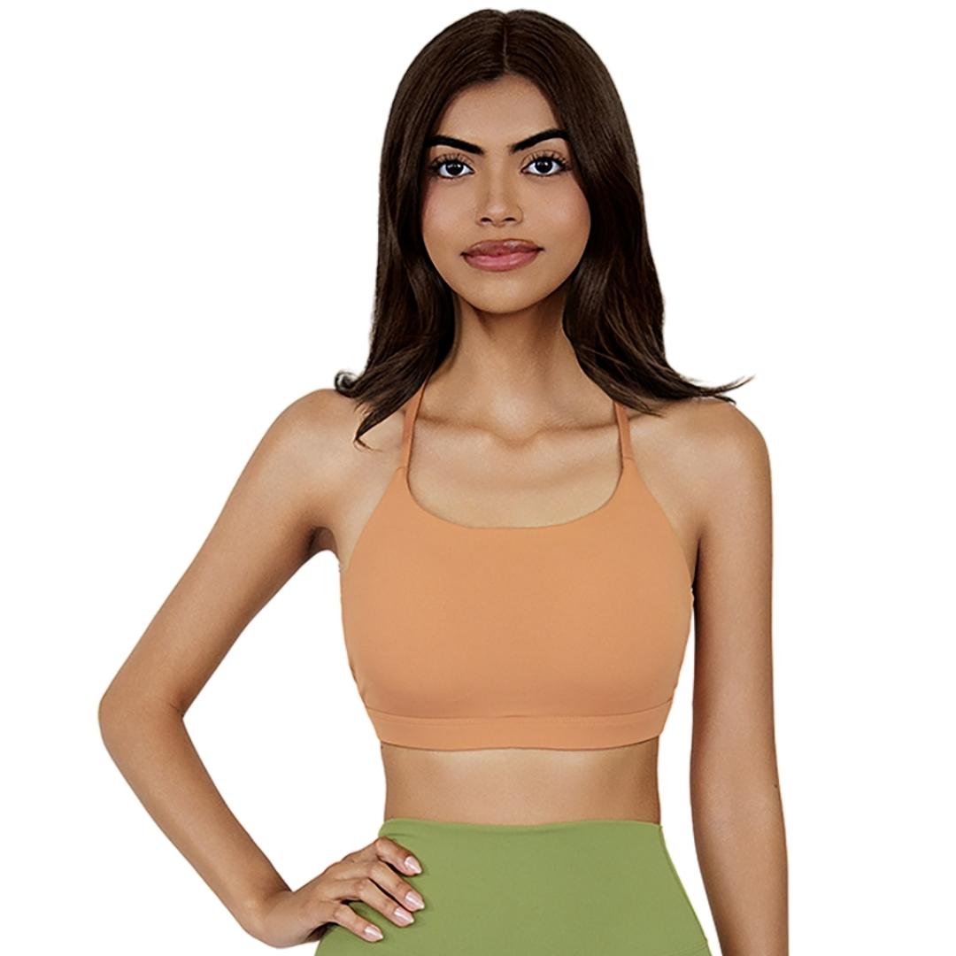 VLIZ SculptFlex Cross-Back Sports Bra in Caramel Orange, featuring a scoop neckline and sleek, supportive fit, ideally for yoga, gym, and lifestyle layering.
