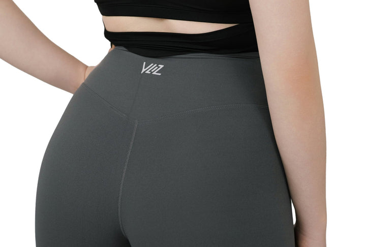 Back view of VLIZ Ultra Soft SculptFit Long Leggings in gray featuring high-rise waistband and logo detail
