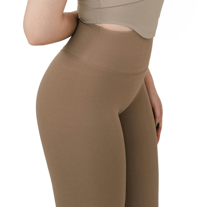 Side close-up view of the VLIZ Ultra Soft SculptFit Long Leggings in khaki, highlighting the sleek side seam, supportive waistband, and smooth fabric fit around the waist and hips.