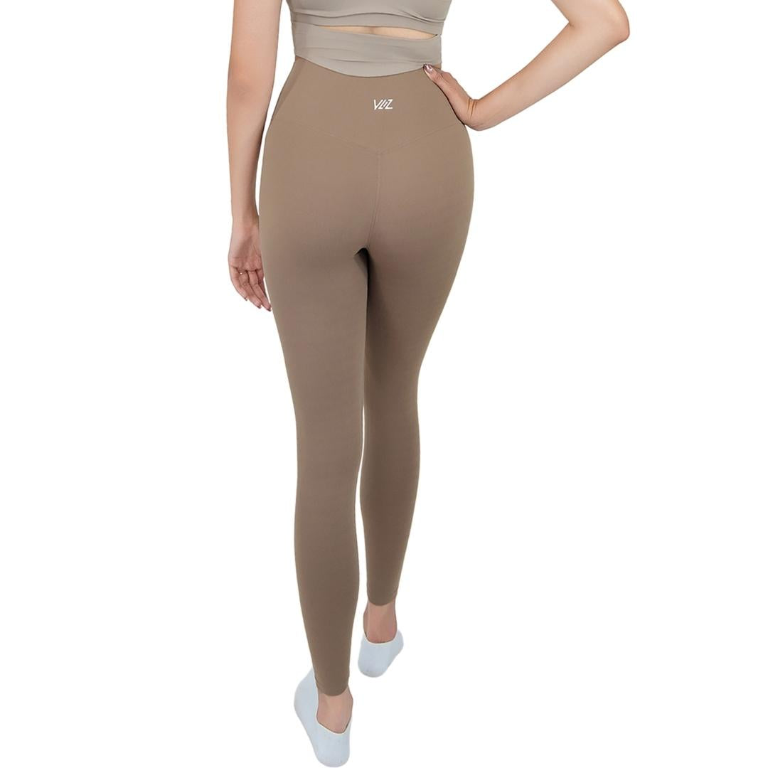 VLIZ Ultra Soft SculptFit Long Leggings in light brown/khaki shown from the side, highlighting the high-waisted fit and sleek leg contour, ideally ideal for yoga and weight training.