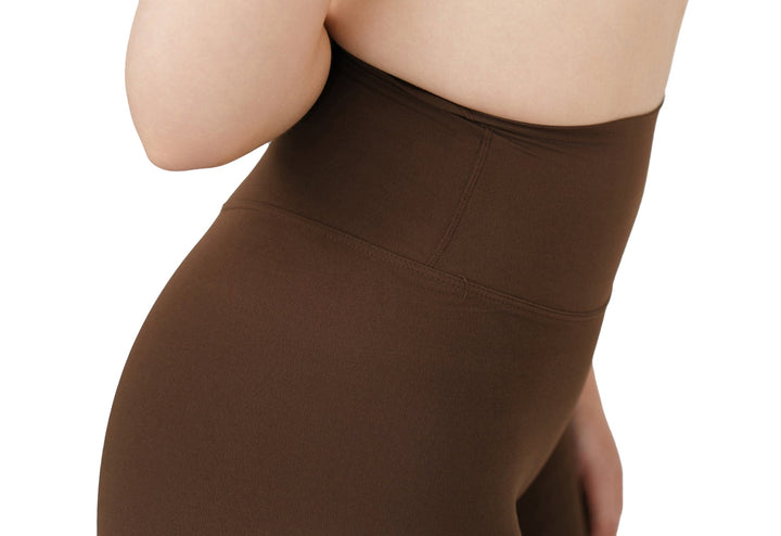 Close-up side view of the VLIZ Ultra Soft SculptFit Mid-Length Legging Shorts in chestnut brown, highlighting the smooth stitching and sculpting fit around the hip and waist.
