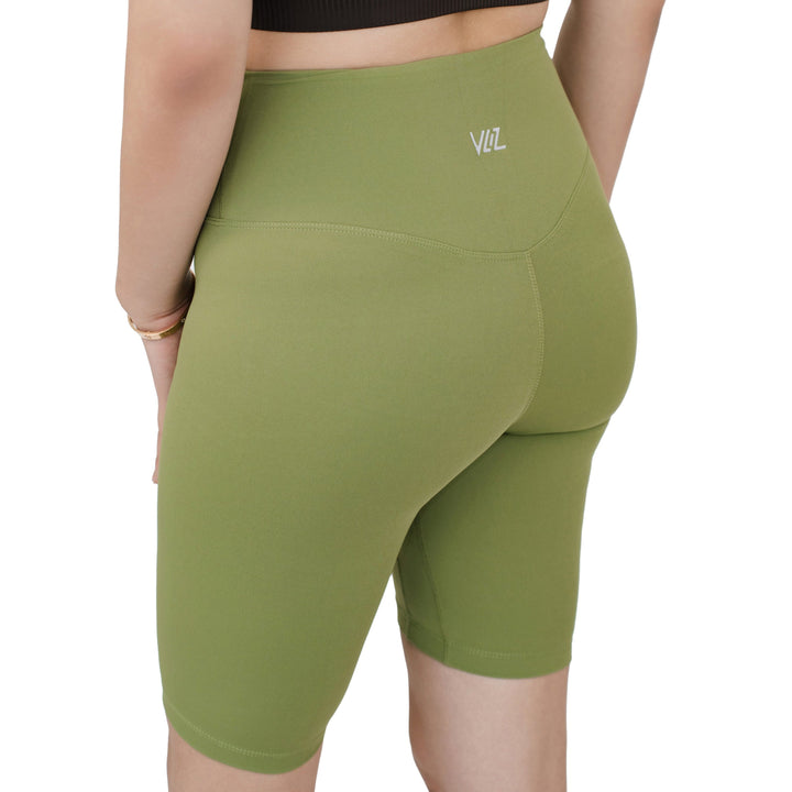 Back view of VLIZ Ultra Soft SculptFit Mid-Length Legging Shorts in Matcha Green, showing the sculpting seam detail and VLIZ logo on waistband.







