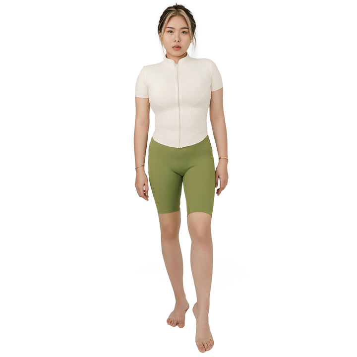 Front view of VLIZ Ultra Soft SculptFit Mid-Length Legging Shorts in Matcha Green, featuring a sleek high-waisted design and compressive contour fit.