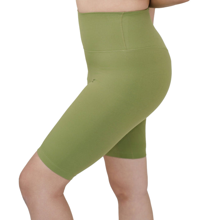 Close side view of VLIZ Ultra Soft SculptFit Mid-Length Legging Shorts in Matcha Green, featuring a high-rise waistband and smooth contouring fit.