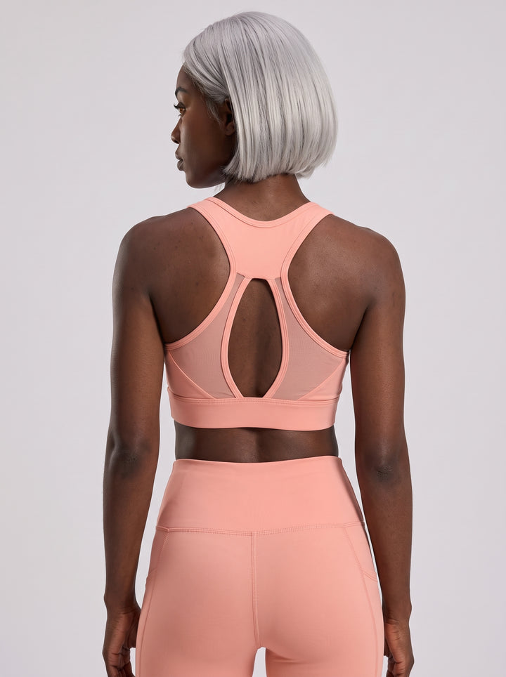 VLIZ women's pink mesh-back sports bra with keyhole detail, back view