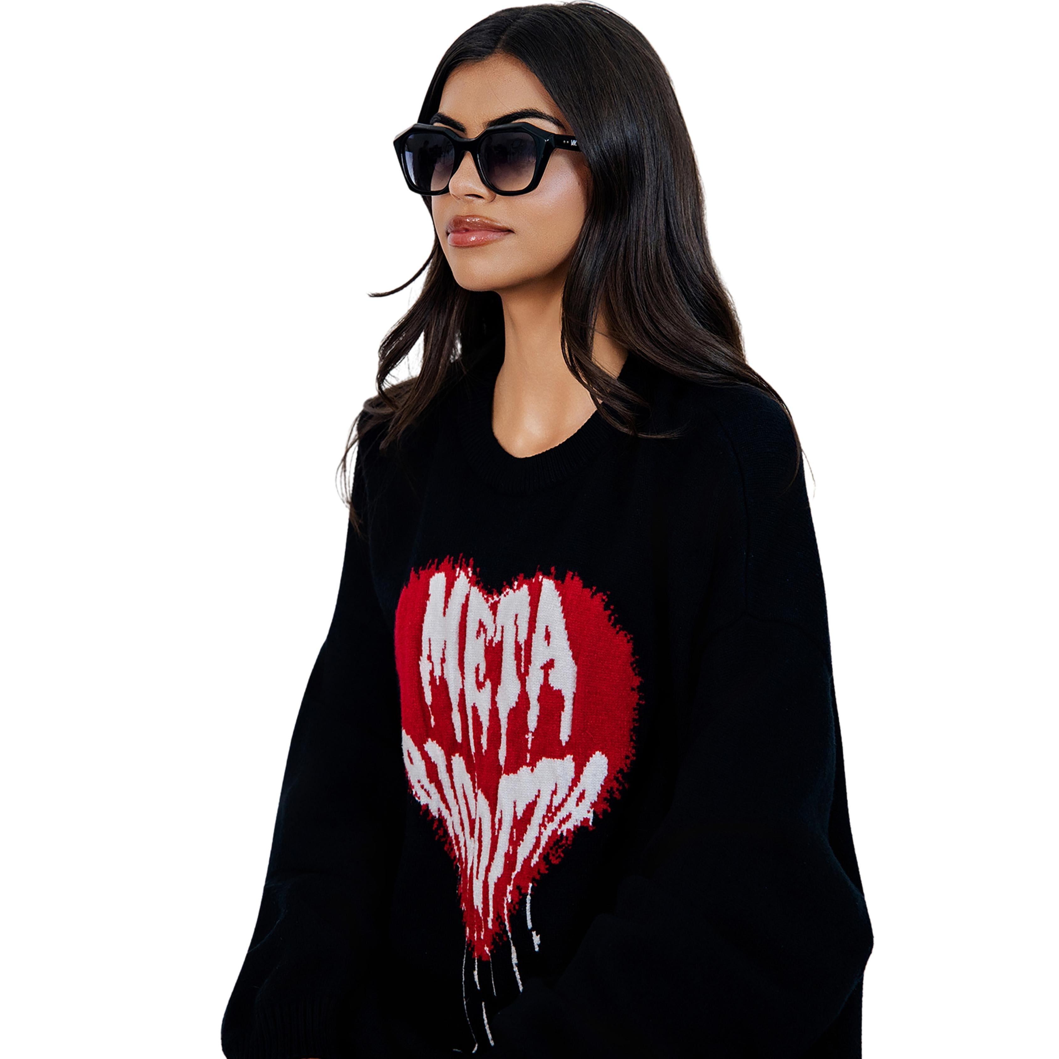 Model wearing VLIZ Altara sunglasses with a black square-oval frame and grey lenses, styled with a hoodie and layered necklace, emphasizing the unisex streetwear-inspired design and UV400 lens protection.