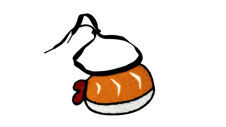 Orange pet bandana with embroidered sushi design, made from soft breathable fabric, featuring an adjustable tie-up style for a stylish and comfortable fit.