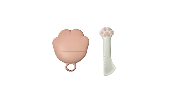 Pink and white pet food can spoon and lid set, made from silicone and resin, designed for scooping, stirring, and sealing wet pet food cans.