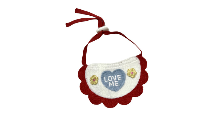 Red knitted pet bandana with lace trim and "LOVE me" embroidery, made from soft yarn fabric, featuring an adjustable tie-up design for a cute and stylish look.