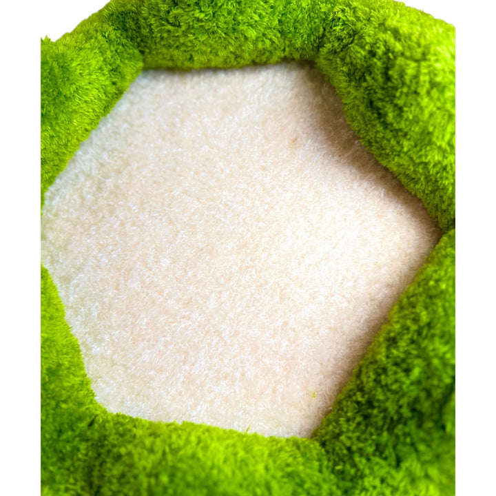 Close-up of soft plush cat bed cushion with green border, designed for comfort and warmth inside VLIZ cat tree.