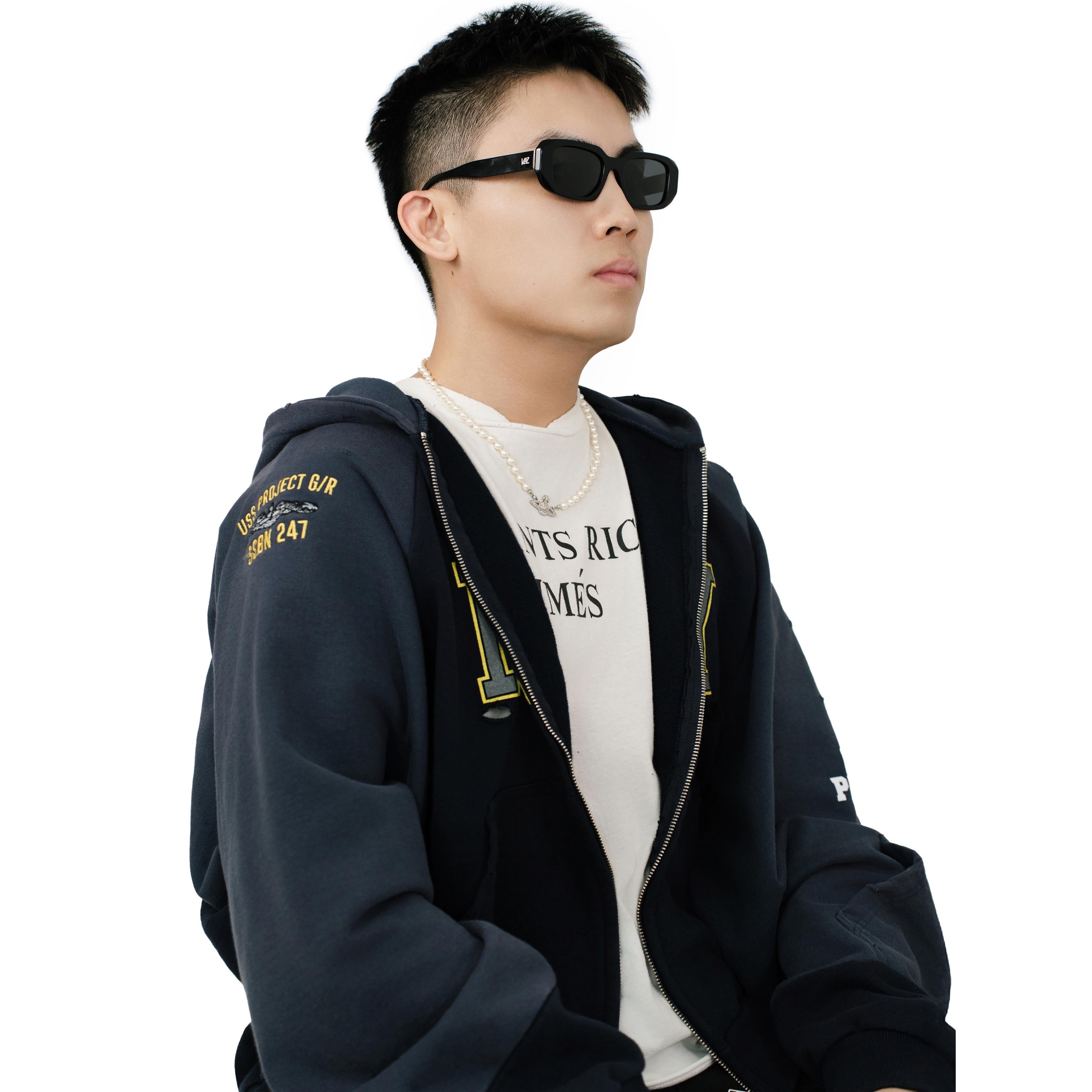 VLIZ Crux sunglasses with black frame and black lenses, square-edge design, engraved logo on temples.