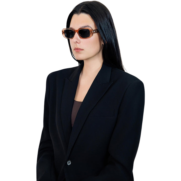 VLIZ Crux sunglasses with pink frame and black lenses, square-edge design, engraved logo on temples.