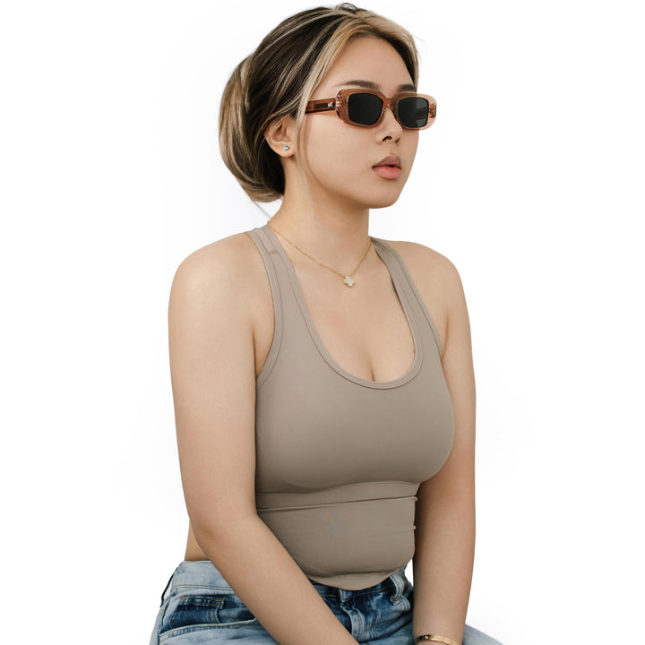 VLIZ Crux sunglasses with pink frame and black lenses, square-edge design, engraved logo on temples.