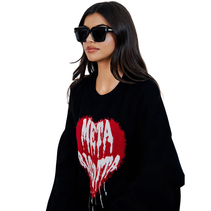 Model wearing VLIZ Gravité black square sunglasses with silver-tone temples and UV400 lenses, paired with a layered hoodie and graphic tee for an effortlessly cool streetwear look.
