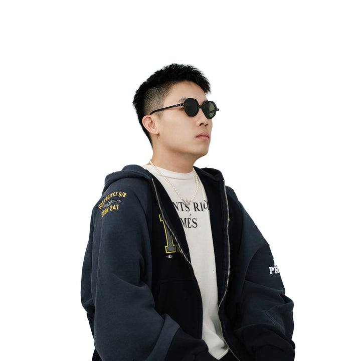 VLIZ Grid sunglasses with black octagon frame and dark green lenses, architectural design with engraved logo on temples.