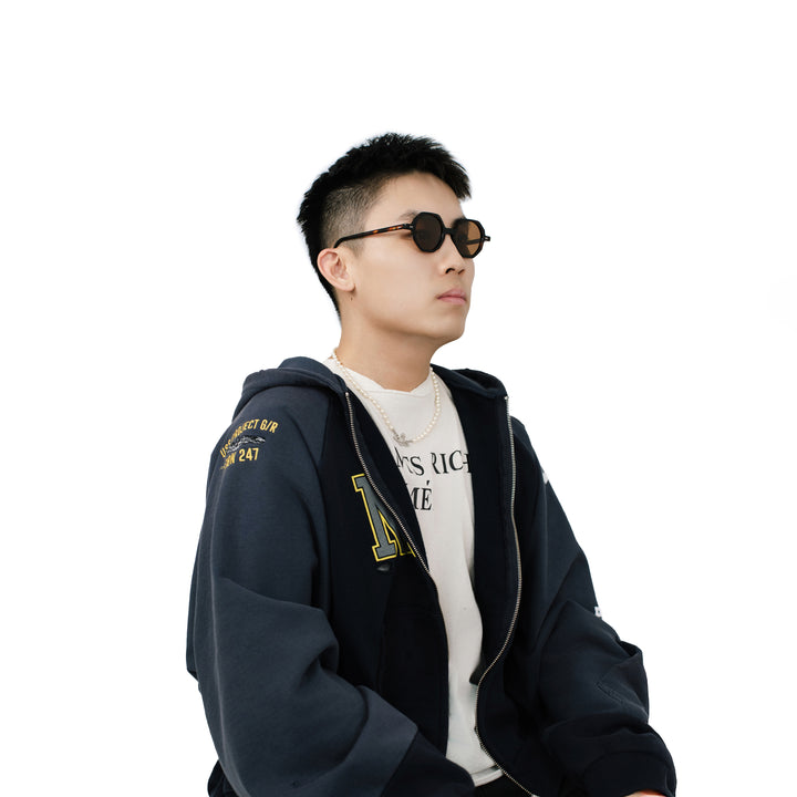 VLIZ Grid sunglasses with tortoise octagon frame and brown lenses, sculptural streetwear design with engraved logo on temples.