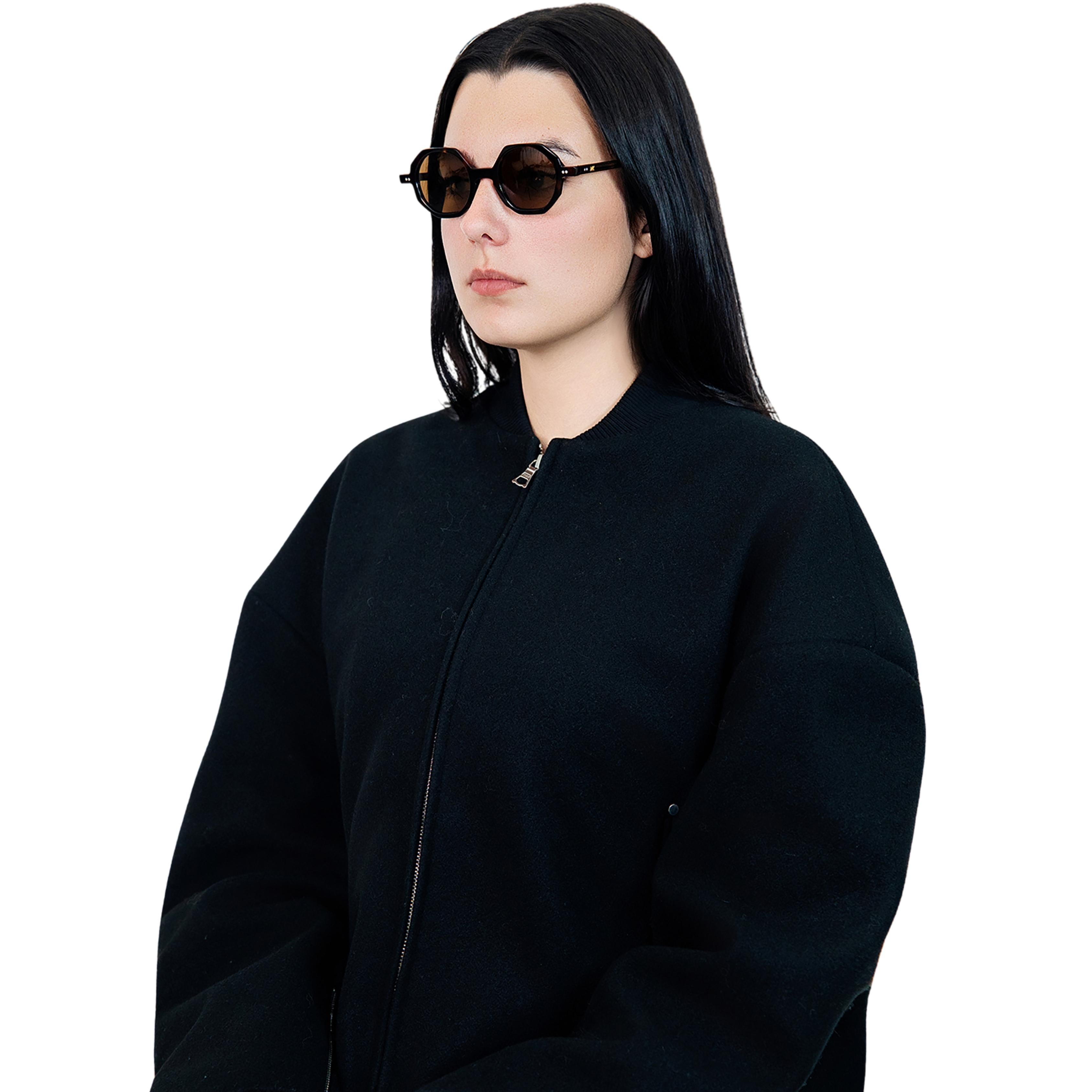 VLIZ Grid sunglasses with tortoise octagon frame and brown lenses, sculptural streetwear design with engraved logo on temples.