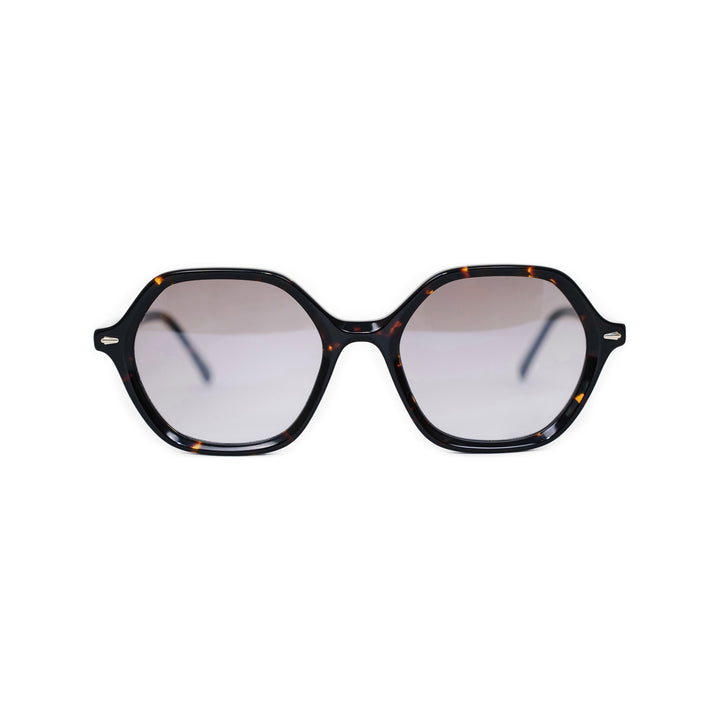 VLIZ Lunelle sunglasses with a tortoise octagon frame and light brown gradient lenses, sculptural silhouette inspired by lunar geometry, engraved logo on temples
VLIZ Lunelle sunglasses with a tortoise octagon frame and gradient lenses, sculptural silhouette inspired by lunar geometry, engraved logo on temples.