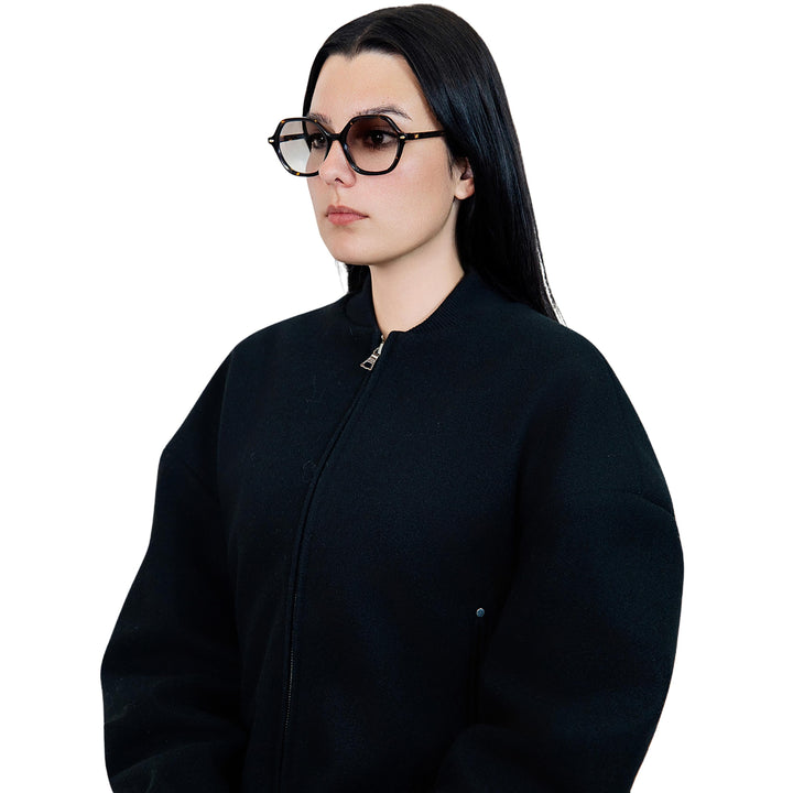 VLIZ Lunelle sunglasses with a tortoise octagon frame and light brown gradient lenses, sculptural silhouette inspired by lunar geometry, engraved logo on temples