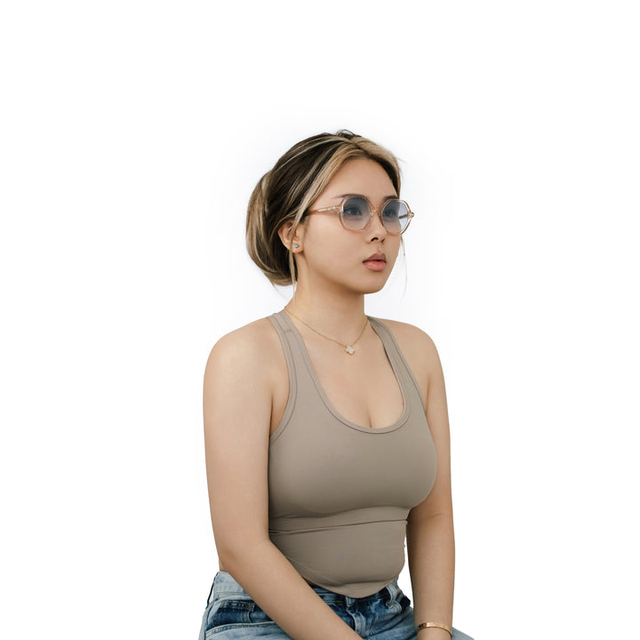 VLIZ Lunelle sunglasses with a translucent tea octagon frame and light blue gradient lenses, sculptural silhouette inspired by lunar geometry, engraved logo on temples
VLIZ Lunelle sunglasses with a tortoise octagon frame and gradient lenses, sculptural silhouette inspired by lunar geometry, engraved logo on temples.