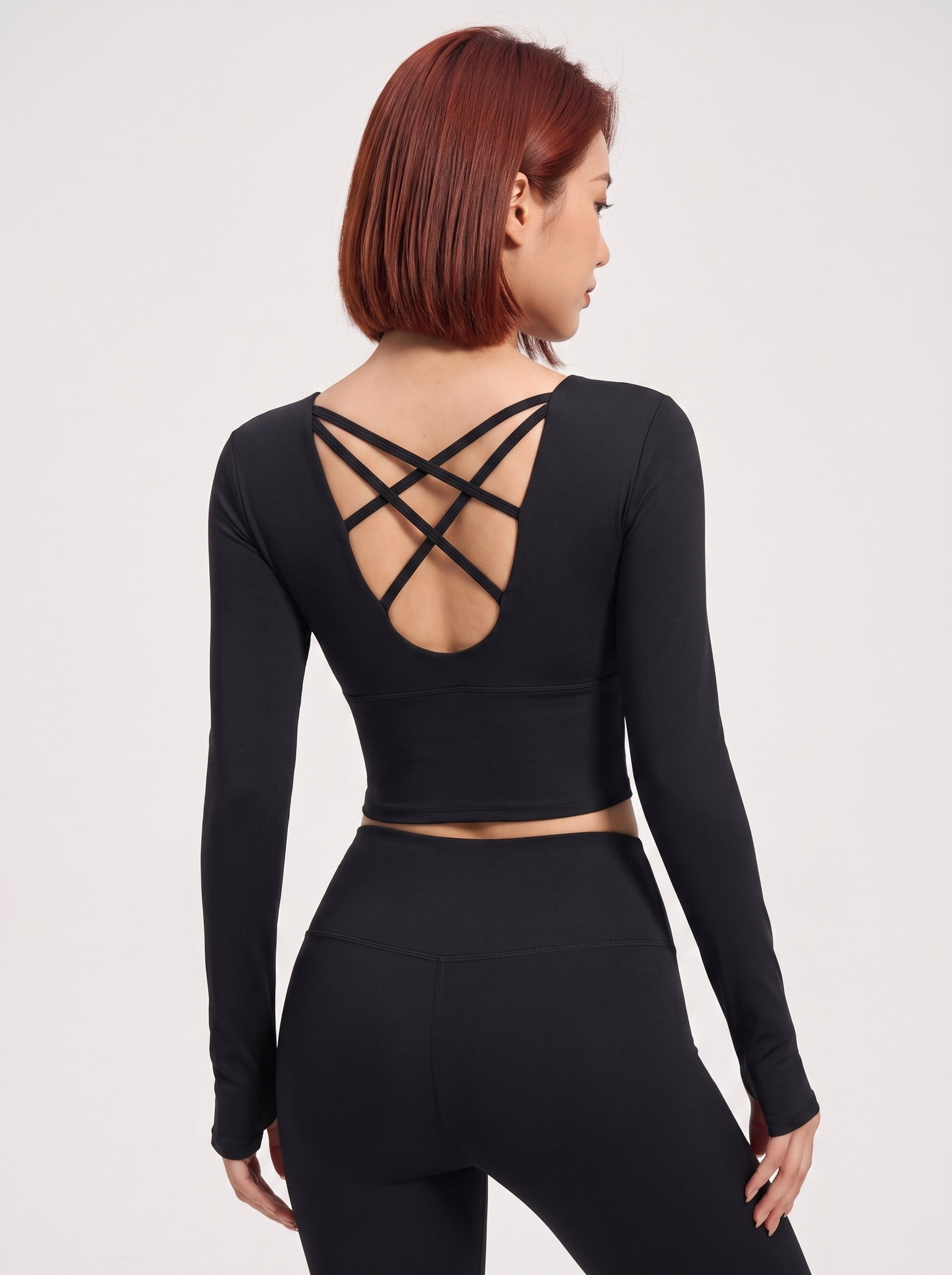 VLIZ black long-sleeve sports bra with cross-back construction, back view