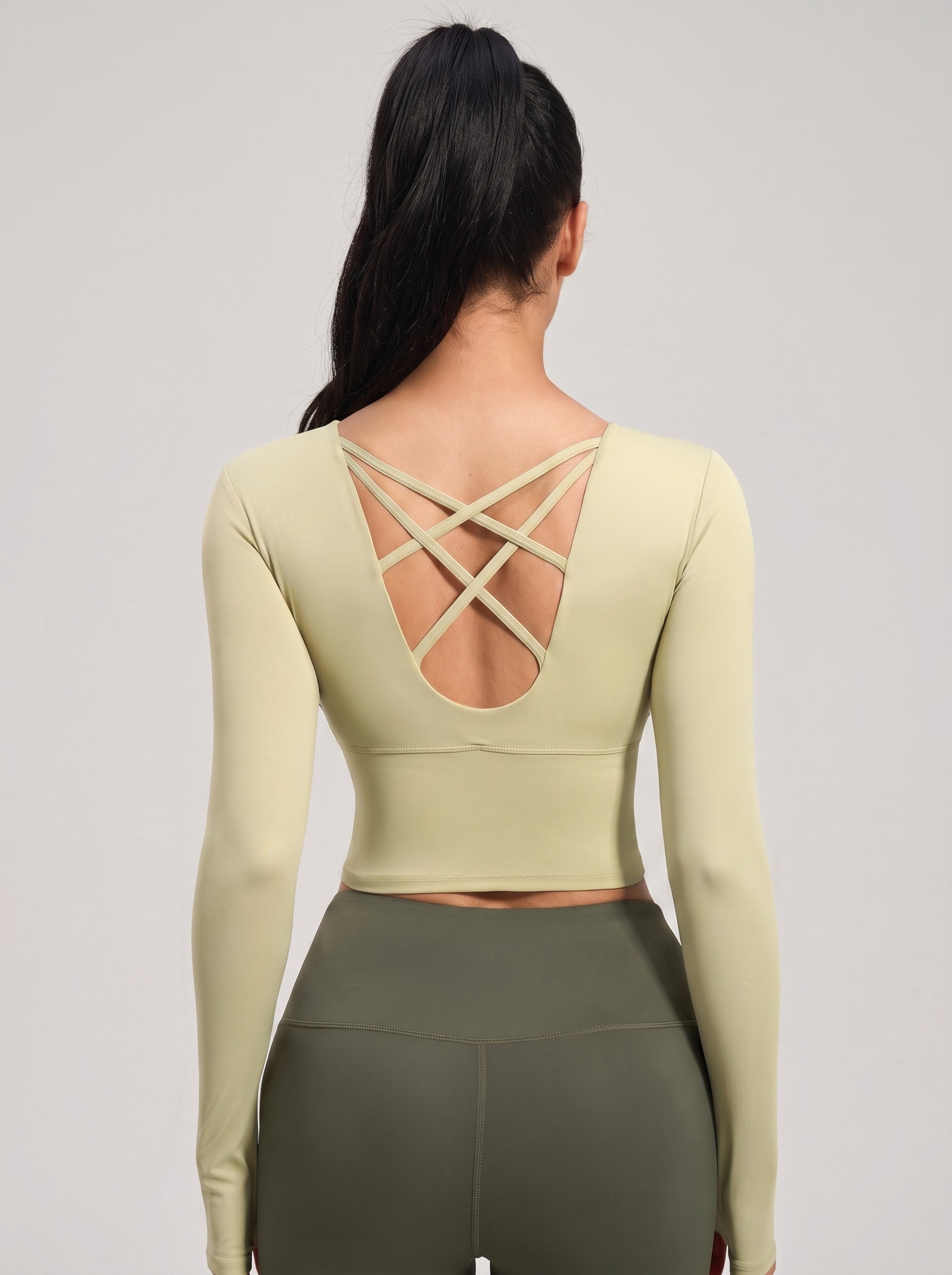 VLIZ light green long-sleeve sports bra with cross-back design, back view